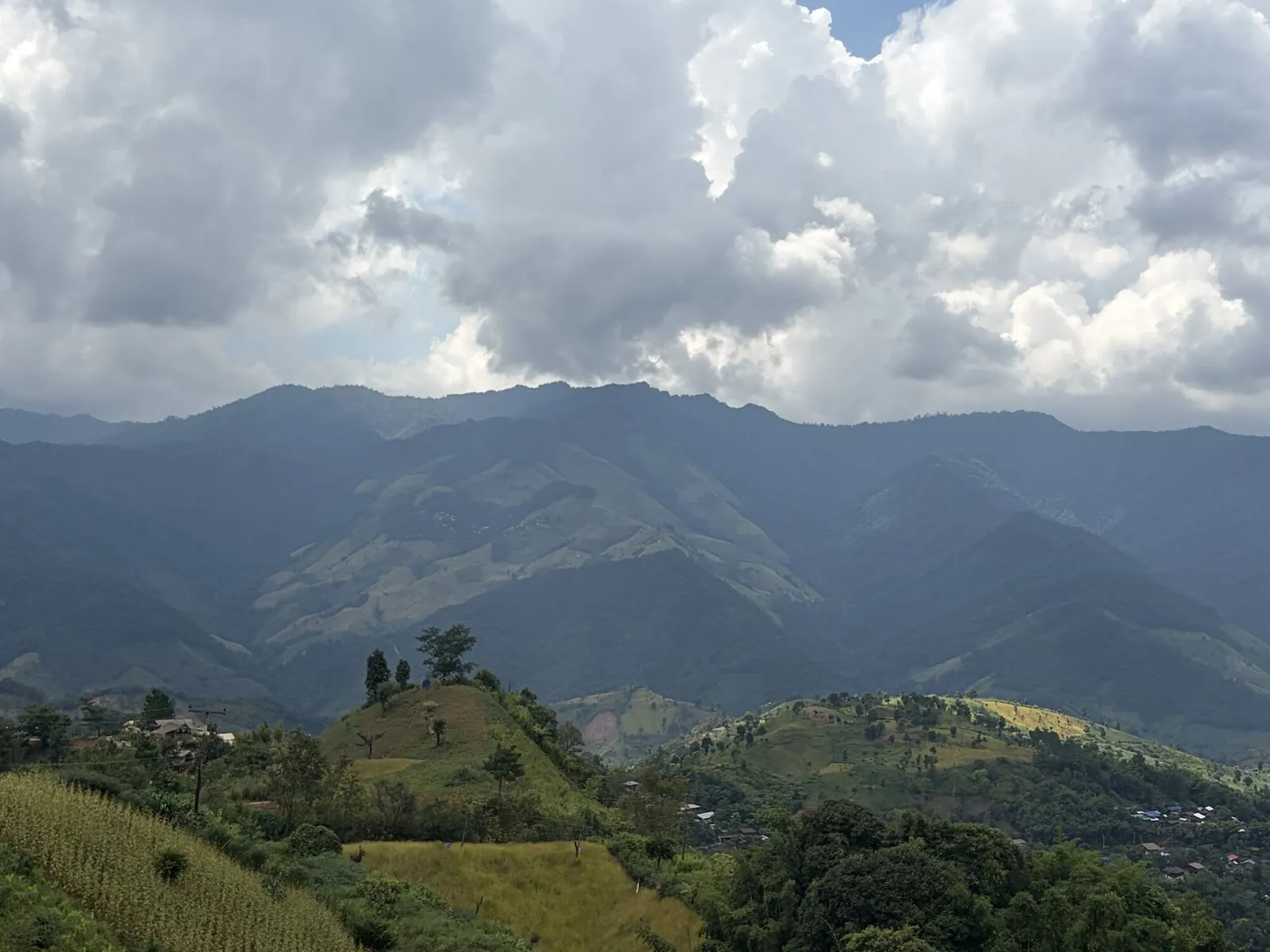 Layered mountain ridges disappearing into cloud