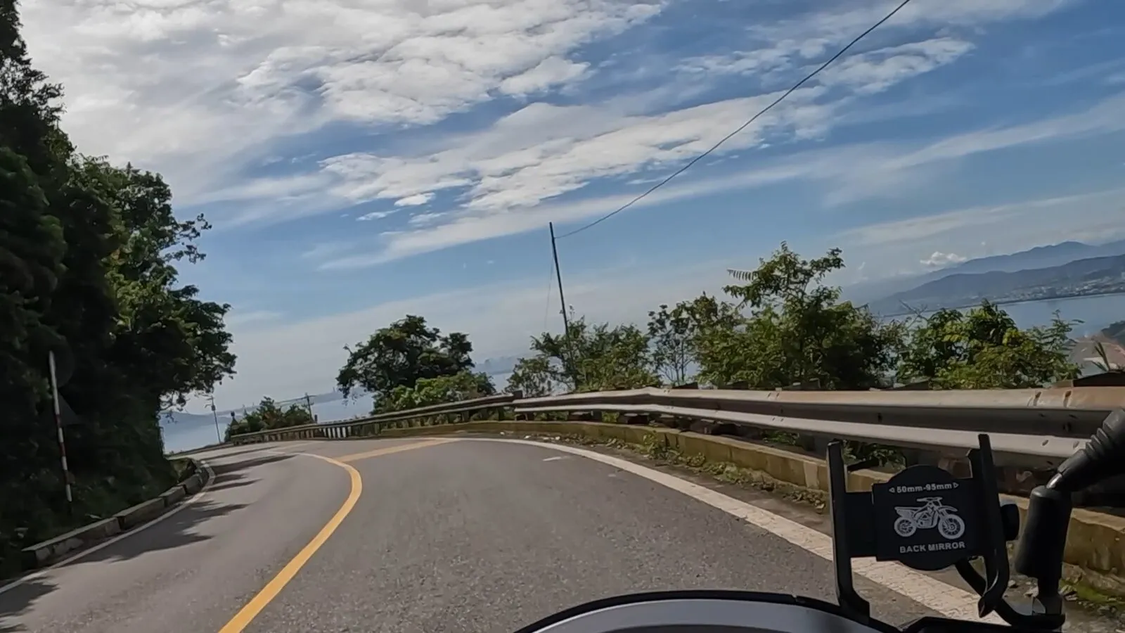 A rider's view of the Hai Van Pass road above the bay