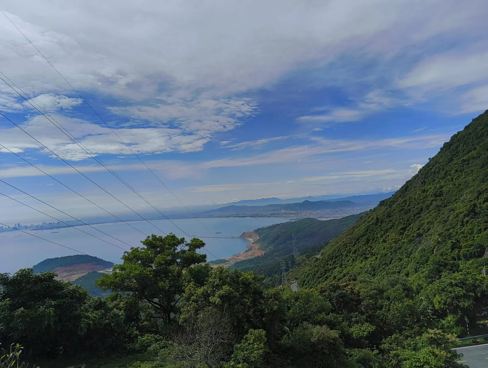 A wide view of the coast and mountains from the pass
